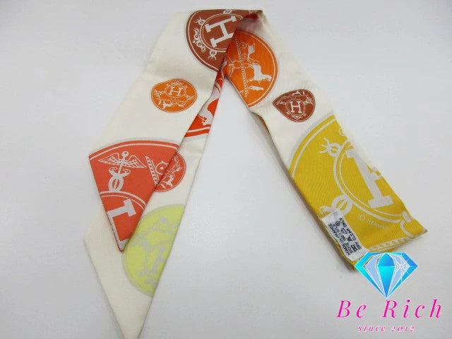 美品 エルメス HERMES ツイリー スカーフ EX-Libris エクスリブリスの紙吹雪 062494S シルク 絹 アイボリー オレンジ ストール 巻物 小物 【中古】【送料無料】 bh2353