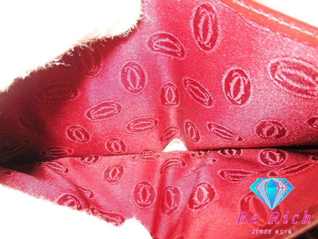 カルティエ Cartier メンズ 二つ折り財布 73184192 マスト ボルドー レザー ロゴ コンパクト ウォレット 【中古】【送料無料】 bs3732