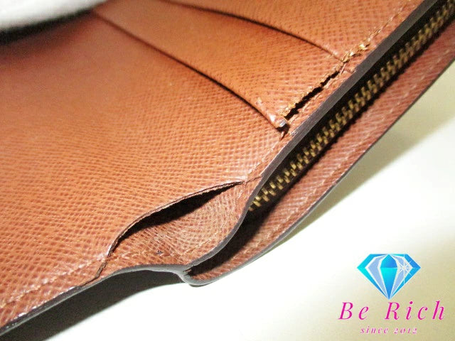 ルイ ヴィトン LOUIS VUITTON 二つ折り財布 モノグラム ポルト パピエ ジップ M61207 茶 ブラウン PVC レザー LV ロゴ 中財布 ミディアム コンパクト ウォレット パスポート入れ 【中古】【送料無料】 bs3735