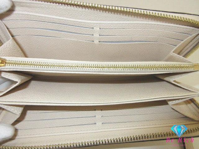 ルイ ヴィトン LOUIS VUITTON 二つ折り財布 長財布 モノグラム アンプラント ジッピー ウォレット M69034 トゥルトレール ベージュ エンボス レザー LV ロゴ ラウンド ファスナー【中古】【送料無料】 bs4262