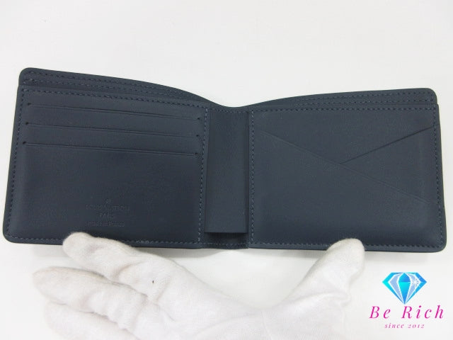 美品 ルイ ヴィトン LOUIS VUITTON モノグラム シャドウ ポルト フォイユ ミュルティプル M83379 ネイビー 紺 レザー LV ロゴ 小銭入れ なし 二つ折り財布 コンパクト ウォレット 【中古】【送料無料】 bs4291