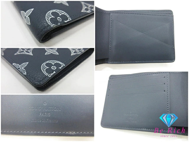 美品 ルイ ヴィトン LOUIS VUITTON モノグラム シャドウ ポルト フォイユ ミュルティプル M83379 ネイビー 紺 レザー LV ロゴ 小銭入れ なし 二つ折り財布 コンパクト ウォレット 【中古】【送料無料】 bs4291